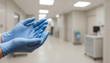 © PuzzleSoul - Close-up of medical hands wearing blue protective gloves, posed as if preparing for a patient procedure in a blurred, clean hospital corridor. Honors for Nurse's Day.