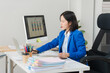 © Wicitr - Focused Professional: An focused professional is working at desk, analyzing data. A scene of quiet productivity.