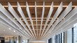 © Justlight - Closeup of acoustic ceiling baffles installed in a hospital corridor focusing on textured materials that minimize sound reflection while surrounding areas stay softly out of focus.