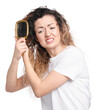 © New Africa - Unhappy woman trying to brush her tangled hair on white background
