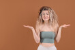 © New Africa - Unhappy woman with tangled hair on brown background, space for text
