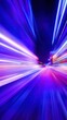 © Newleks - Night city motion with blue and purple light trails creating a dynamic abstract background conveying speed, technology, and futuristic energy in urban transportation