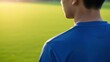 © Audax - Close Up Back Of Athlete In Blue Jersey On Pitch