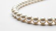 © Audax - String of white pearls on white background