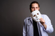 © Ranta Images - Doctor Removing White Mask - Medical Identity and Transparency Concept Portrait