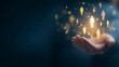 © Alex Alex - A human hand on a dark background, with glowing yellow icons of people floating above it, representing the concept of human resources management, customer base, leadership, and teamwork.