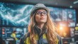 © NovaVision - Woman engineer in hard hat and safety vest looking up at control room screens