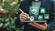 © munayem - Businessman using a digital tablet to manage ESG (Environmental, Social, Governance) initiatives with icons for family protection, house, recycling, nature, and growth.