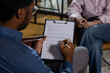 © zinkevych - Man writing on form during session