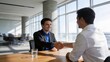 © 炎武 顾 - Two men shaking hands in an office