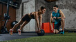 © master1305 - Personal trainer guiding woman during functional fitness workout with medicine ball in gym. Concept of personal training, fitness coaching, motivation and healthy lifestyle training routine