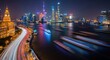 © Tika - Vibrant Night City Skyline with Light Trails Along Riverside