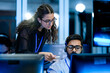 © ultramansk - IT service management specialist resolving technical support tickets with supervisor. Female operations manager auditing workstation workflow efficiency strategies.