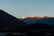 © ADDICTIVE STOCK - Full moon over Dolomites at sunset in Pergine Valsugana