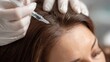 © vetrana - Person receiving treatment for alopecia at a clinic during a wellness session in the afternoon