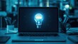 © Tashik - A glowing lightbulb on a dark laptop screen in a dimly lit room