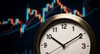 © thenort - A clock face in front of a fluctuating financial graph, suggesting time and investment