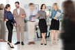 © New Africa - Happy coworkers indoors, motion blur effect. Busy office life