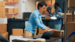 © DC Studio - Small business owner putting supplies in cardboard boxes, shipping merchandise to customers. Young woman preparing shipment with warehouse goods, retail and logistics. Tripod shot.