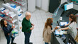 © DC Studio - Diverse customers waiting in line to pay for drugs or pills at pharmacy shop counter, having prescription medicine and needing supplements. People buying pharmaceutics and medicaments.