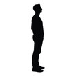© Nasrin - A full body silhouette of a man standing with his hands in his pockets and looking to the side with a neutral expression presented on a white background vector on white background