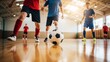 © Bayu Tri Nugroho - Children and adults playing indoor soccer on a wooden court with bright sunlight streaming through large windows