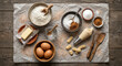 © JINHEON JANG - Overhead flat lay of Churro baking ingredients on dusted wax paper