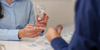 © Natee Meepian - Sustainability brainstorming with light bulb and charts