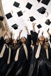 © Rawpixel.com - Joyful graduates celebrating achievement.