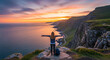 © iman - a woman cheered by spreading her arms facing the setting sun. An achievement in life enjoying the beauty of nature