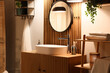 © Pixel-Shot - Interior of bathroom with sink and mirror in evening