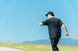 © buritora - A man running or jogging under a blue sky (athlete, aerobic exercise, workout, fitness)