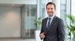 © benjamin - A confident business professional, radiating positivity and expertise in a modern, light-filled office setting.
