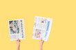 © Pixel-Shot - Woman with newspapers on yellow background