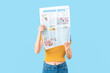 © Pixel-Shot - Young woman with newspaper on blue background