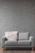 © Pixel-Shot - Sofa with fur mat near grey brick wall in room