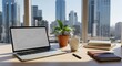 © Tep - A laptop with a financial graph on its screen, placed on a desk with a city skyline in the background.
