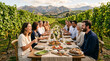 © Rencart - Friends enjoying a long table vineyard dinner with wine and shared food at golden hour