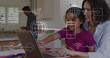 © vectorfusionart - Guiding woman and child in magenta shirt teal trim using laptop at kitchen, showing digital icons