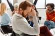 © Maria Vitkovska - Man experiencing stress in group therapy session