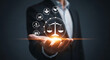 © fitria - A businessman holds a glowing icon of scales of justice, symbolizing legal services and business law.