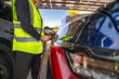 © ultramansk - Engineer in safety vest and helmet pointing towards a solar powered carport, illustrating eco-friendly innovation in parking infrastructure. Solar panels provide shade and sustainable energy.