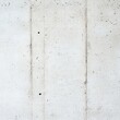 © Photo18@desing - Minimalist light gray concrete wall texture, full frame vertical background with raw industrial surface details, pores and distinct formwork tie holes. building, architecture