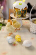 © Cavan Images - Easter table with traditional cake and cute chicks