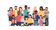 © Santriman - A diverse group of adults and children of various ethnicities and ages, posing together for a group portrait, representing family and community.