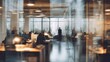 © Salsa - Modern office interior with blurred people working, viewed through reflective glass