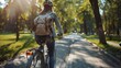 © Natalia - Back view of a young woman wearing a helmet and backpack while riding a bicycle through a green park. The image captures freedom, movement, and an active lifestyle, perfect for themes of travel.