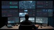 © Selvi - It professional monitoring multiple computer screens with data visualizations and cybersecurity alerts in a high-tech office environment