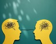 © miss irine - Two yellow human head profiles face each other. A black line connects their scribbled brains. Symbolizes connection empathy understanding and shared thoughts. Represents communication.