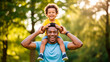 © Simone Matos - Joyful African American Father Gives Son Piggyback Ride in Sunny Park Scene